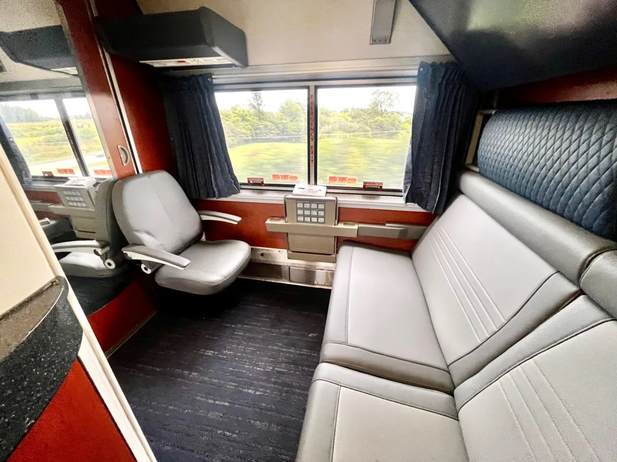Amtrak Auto Train Superliner Bedroom cabin interior showing sofa and armchair layout