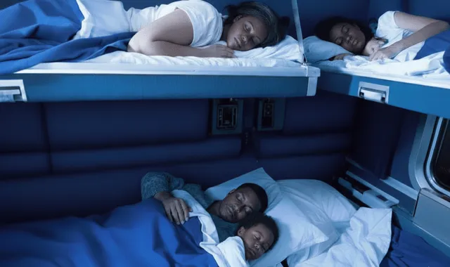 Family sleeping comfortably in the private Amtrak Auto Train Family Bedroom cabin